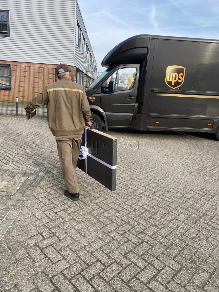 The UPS driver carrying a   steel world map